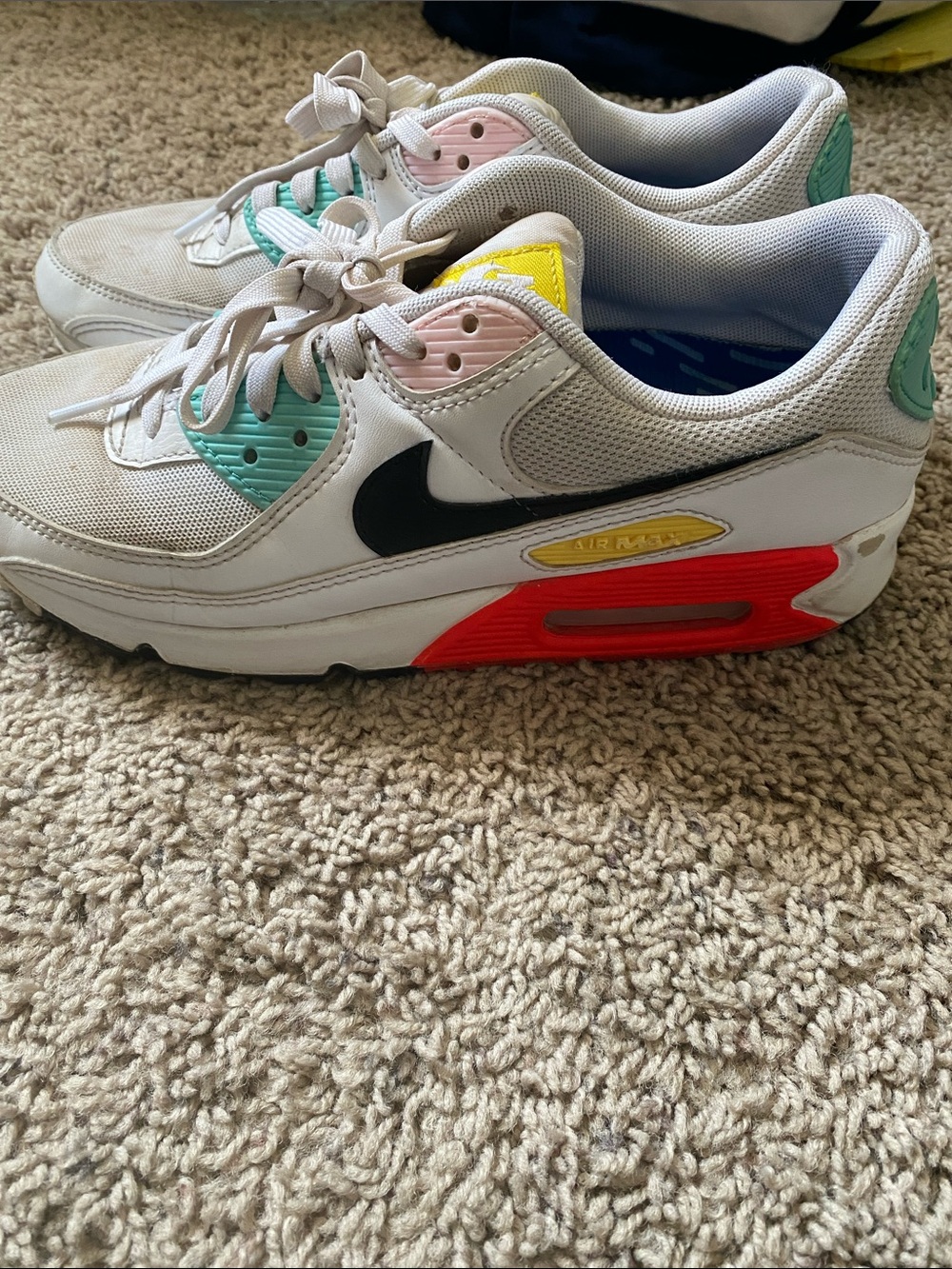Nike White Low-Top Sneakers with Black Swoosh and Multicolor Accents